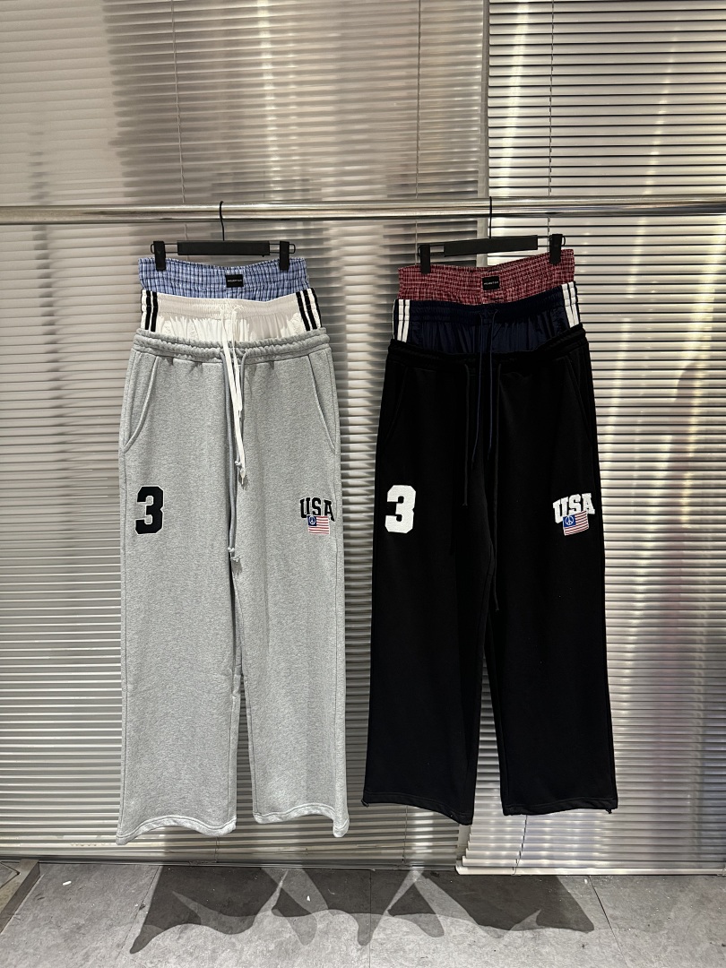 Streetwear Brand In Usa - กางเกงสเวตแพนท์แฟชั่นสตรีทแบรนด์ 25SS ทรงสามชั้นเอวผูกเชือก ปักลายธงชาติอเมริกา แต่งผ้าแบบแพทช์เวิร์ค ขากว้าง